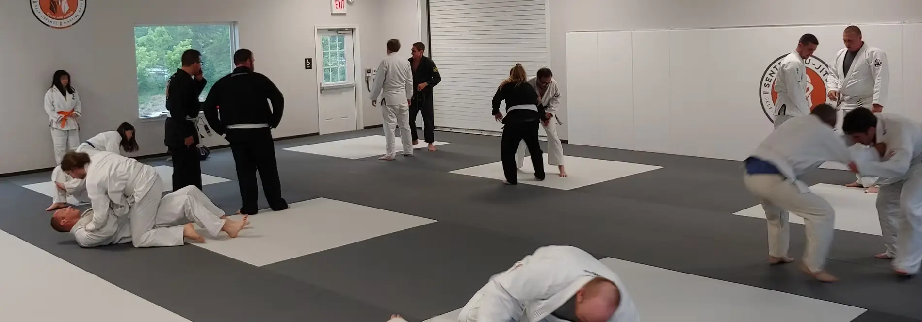 The matted training floor at Sentry Jiu-Jitsu with members training